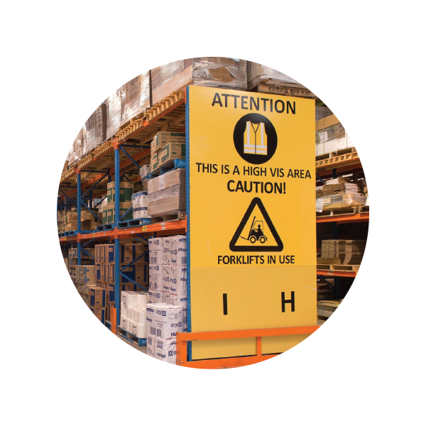 Yellow attention sign in warehouse